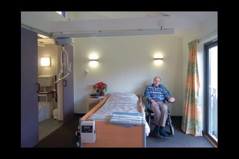 Bill Barnes, paralysed by a stroke, enjoys the daylight, space and hoist to the bathroom